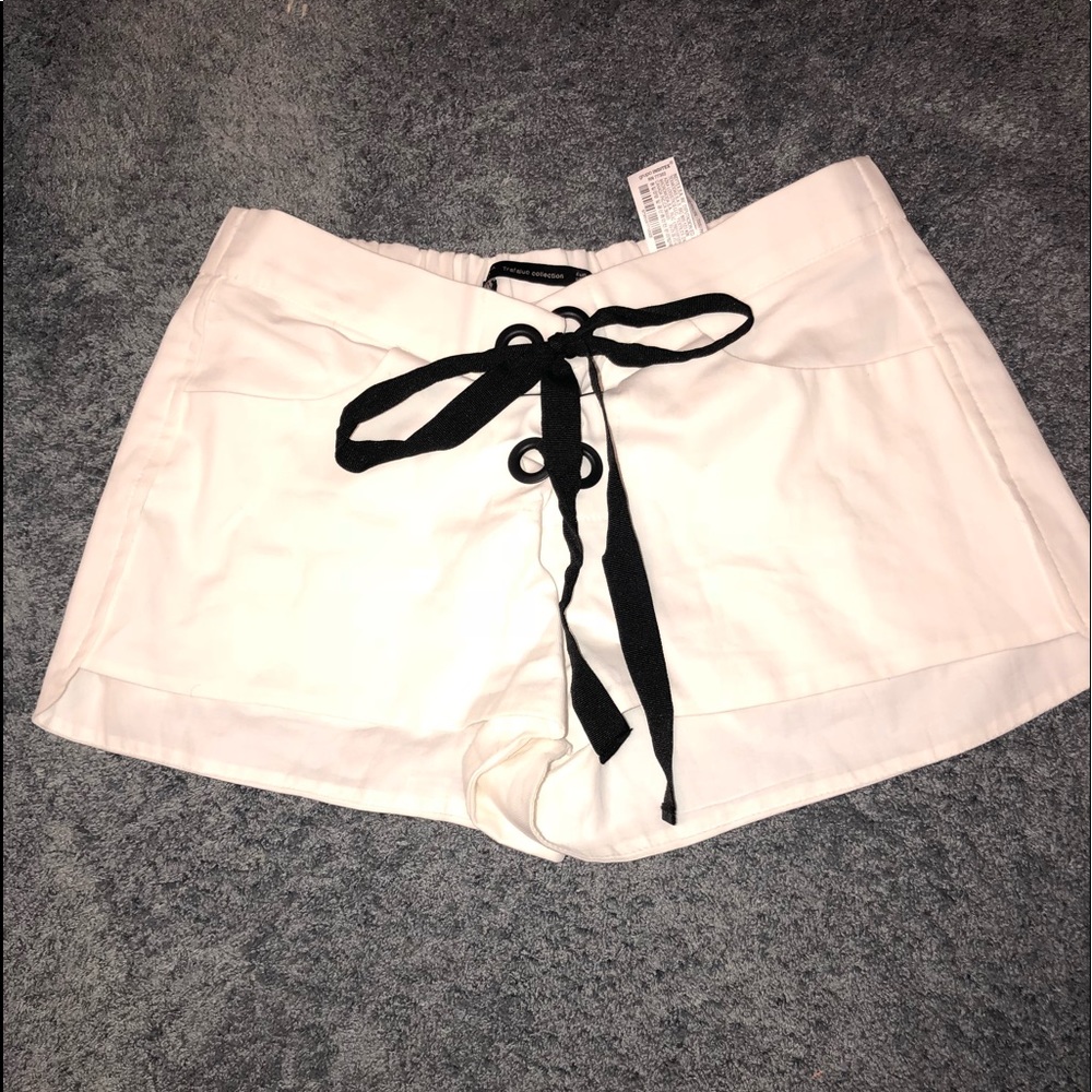 white “Zara” shorts